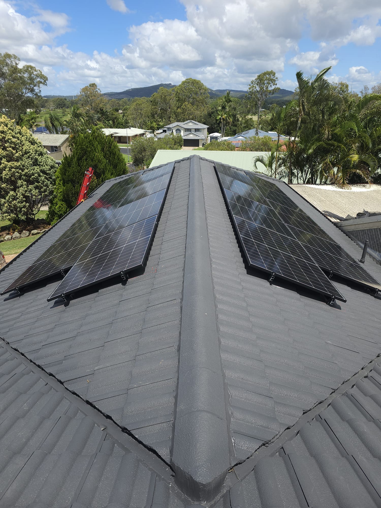 Solar panels installed across both sides of Queensland roof ridge